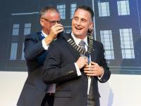 Sam Heppell receiving the National Chair from Billy Ferguson